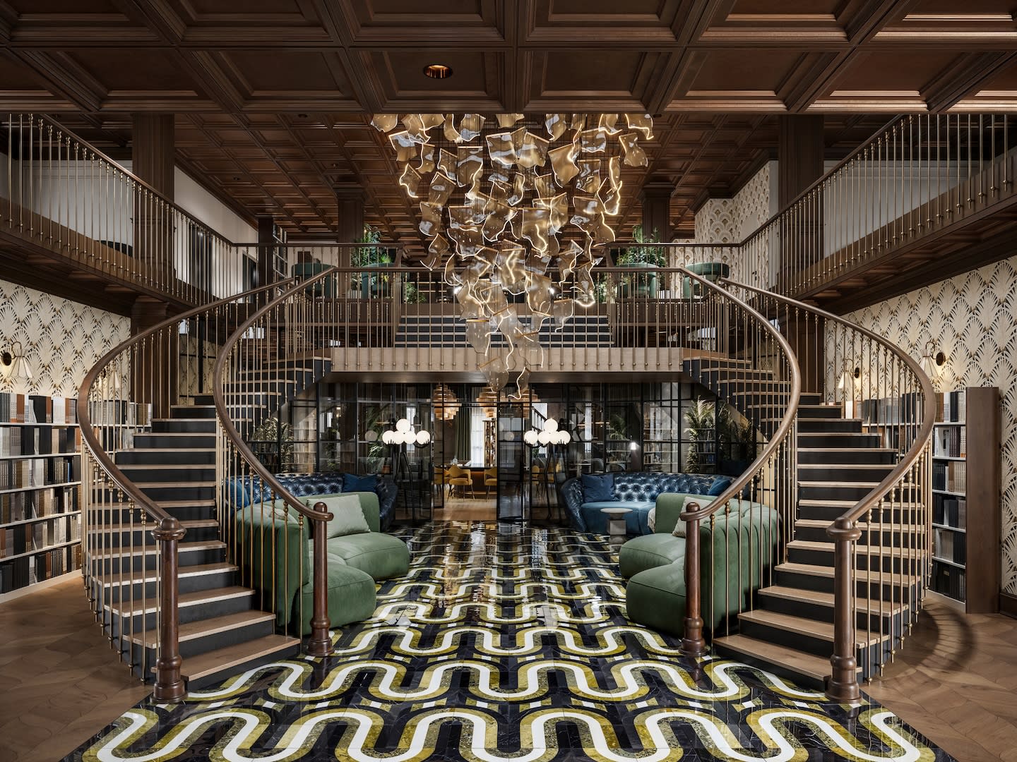 Luxurious library with dual spiral staircases, intricate black and yellow floor pattern, central abstract chandelier, and plush green seating.